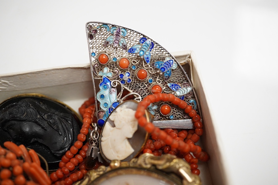 A Victorian yellow metal and coral bead set mourning brooch, with plaited hair beneath a glazed panel, 22mm, a filigree 925, coral and enamel set fan brooch and six other items including a coral branch and bead cluster b